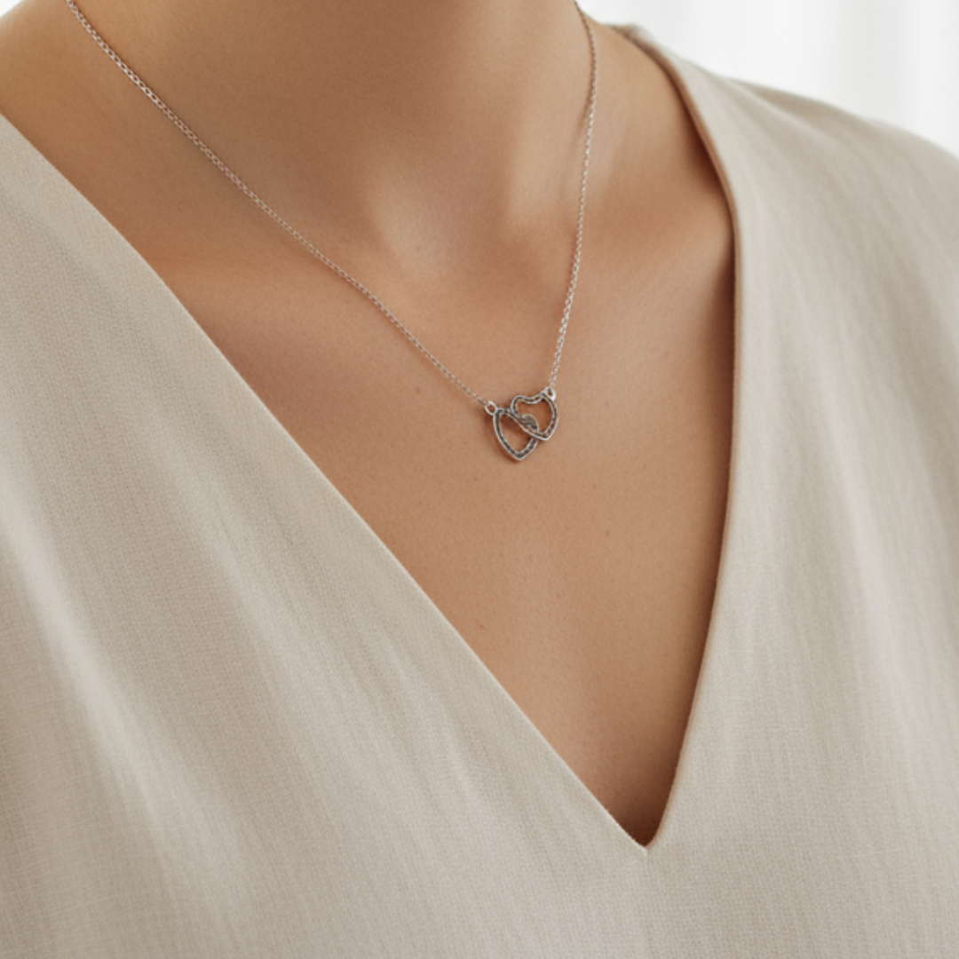 Colgante corazones enlazados de cenizas